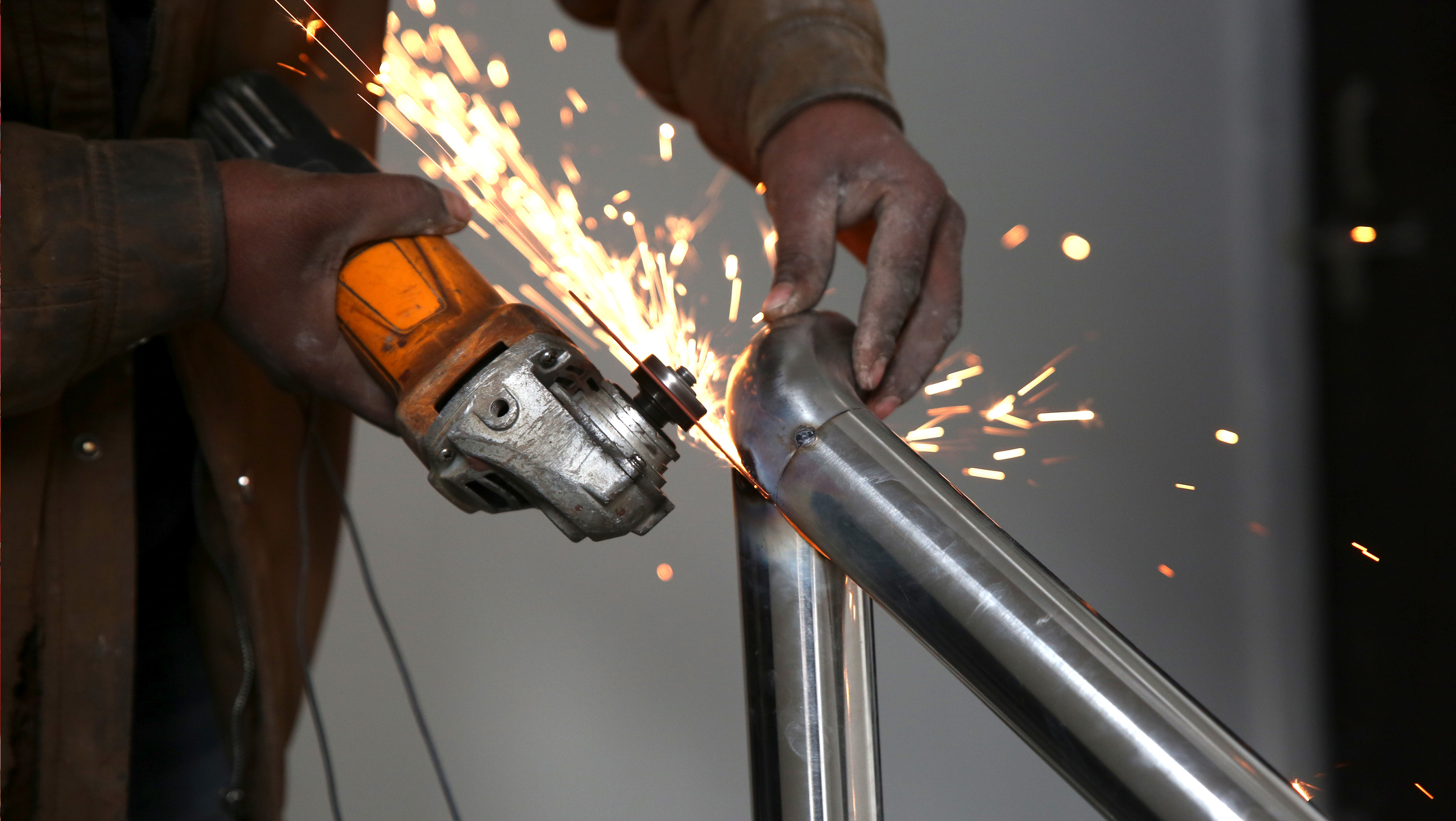 Sparks flying from metal cutting tool.